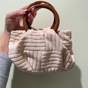 Elegant Cream Handbag with Brown Handles